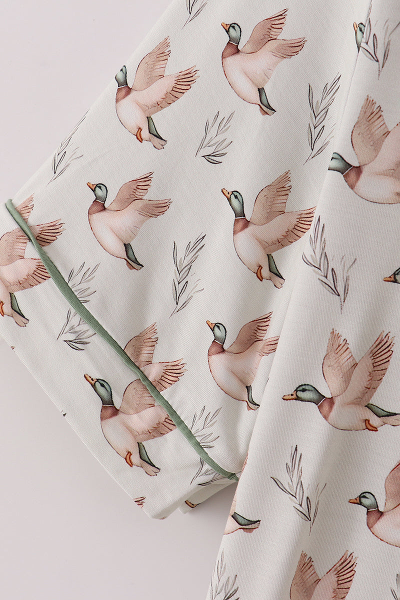 Fabric with duck pattern on a light background