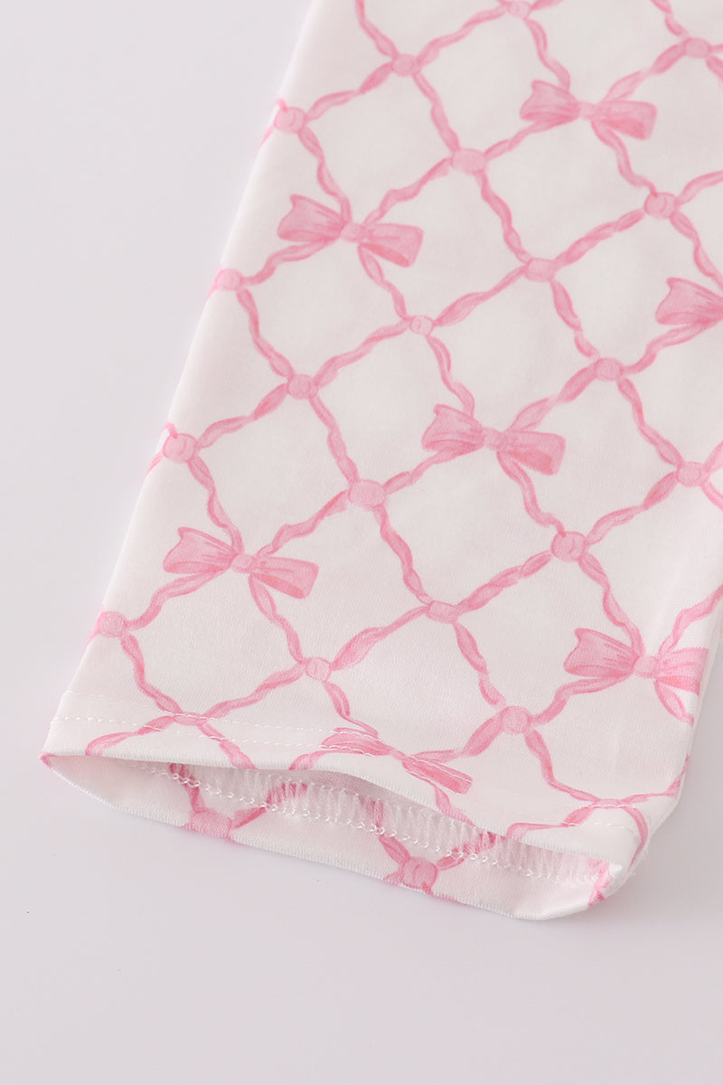 Baby blanket with pink lattice pattern on a white background