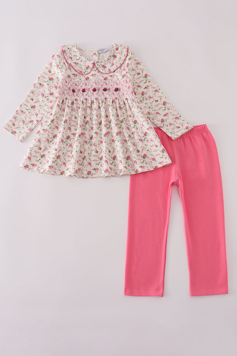 Floral dress and pink leggings set on a light gray background