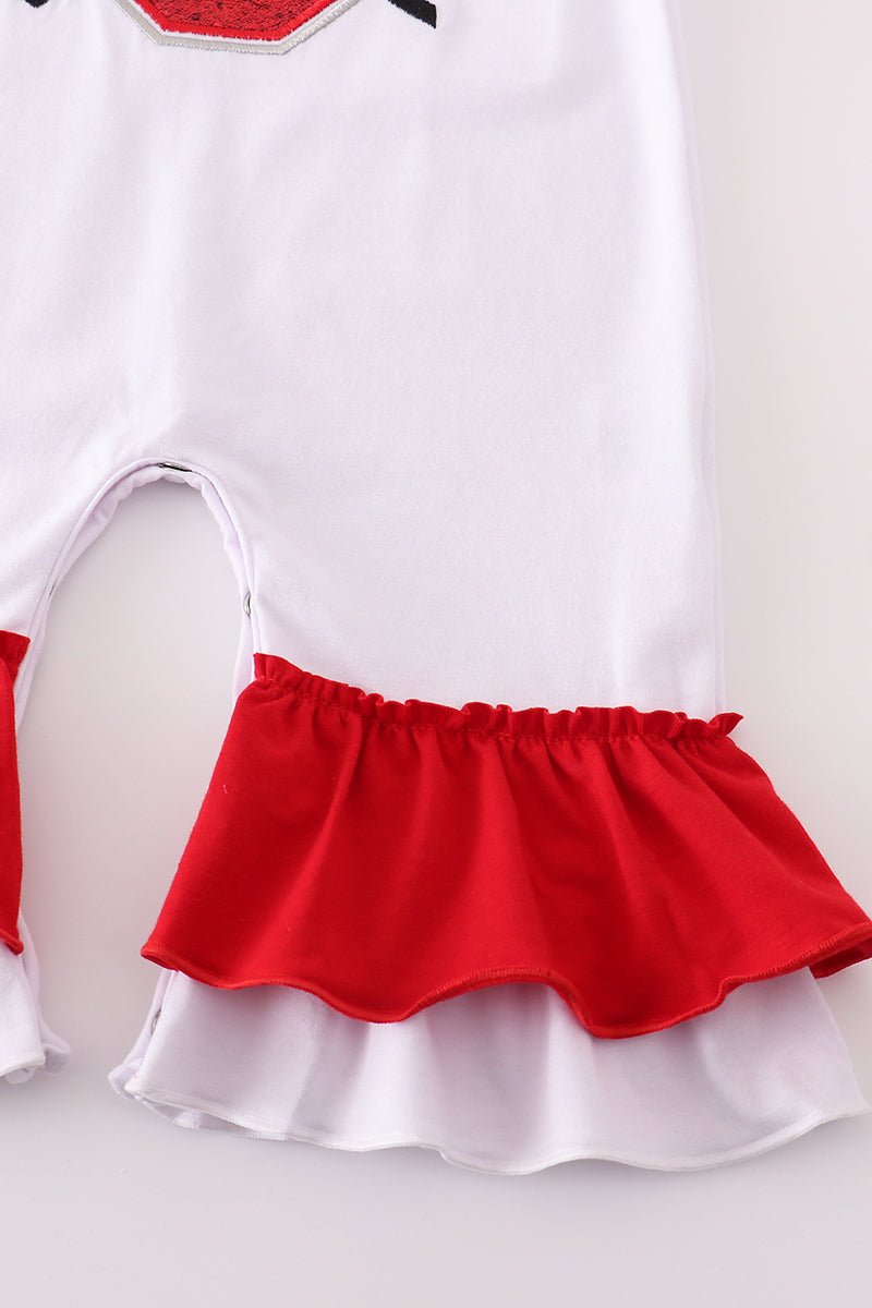 White dress with red skirt on a plain background