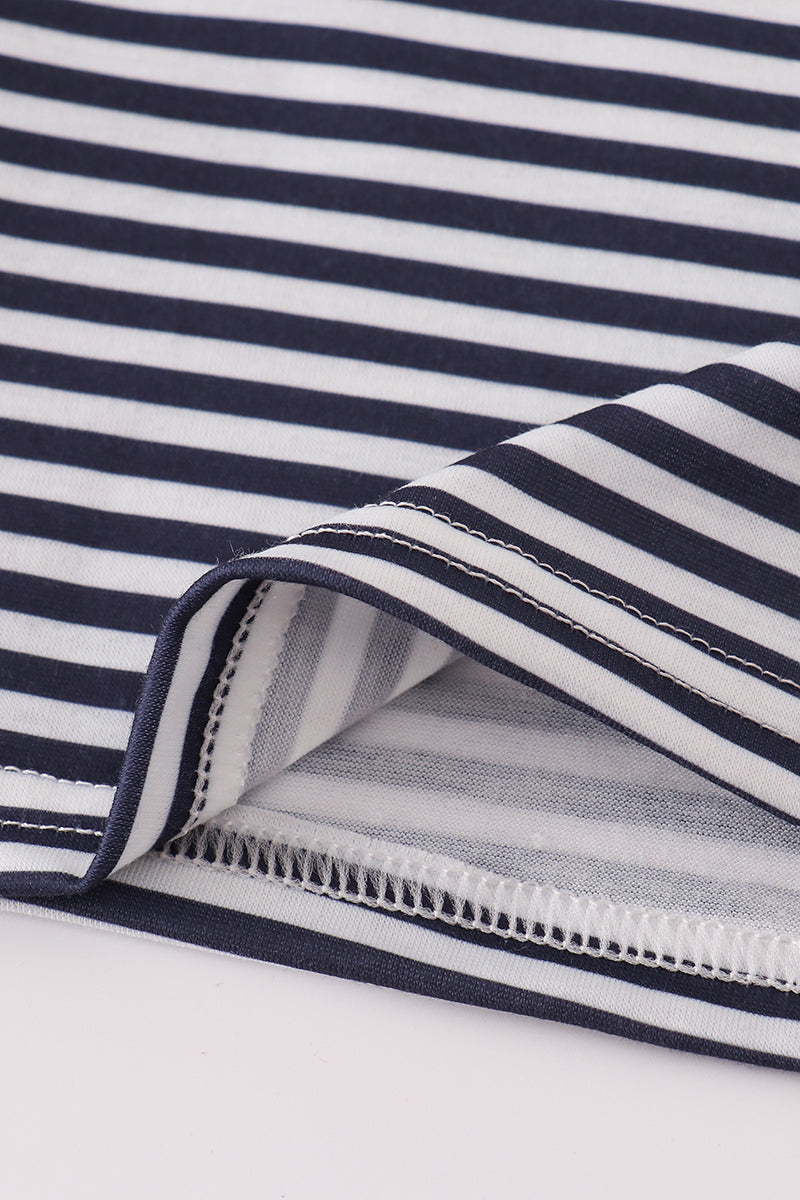 Close-up of navy and white striped fabric with a zipper