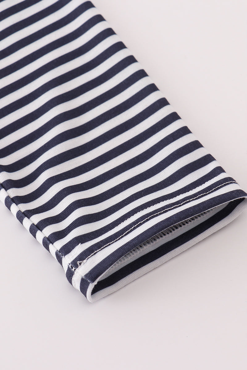 Navy and white striped fabric on a light gray background