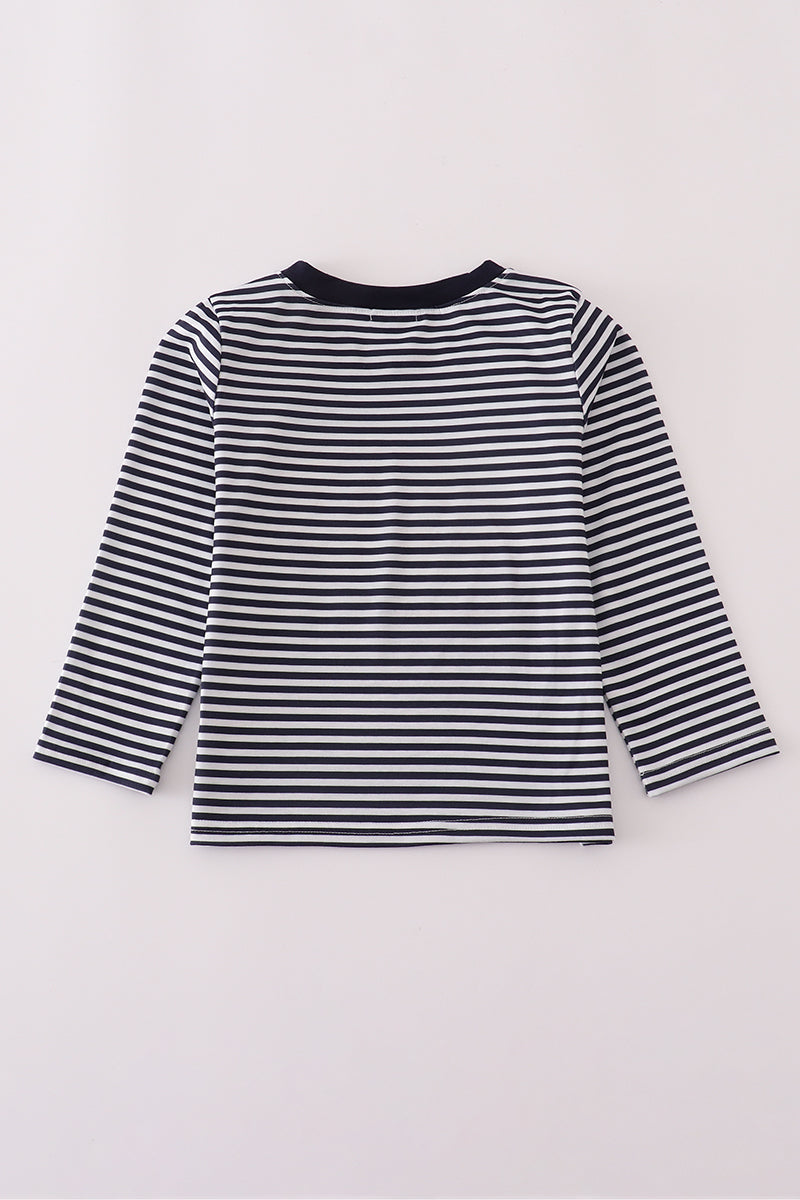 Black and white striped long-sleeve shirt on a light gray background