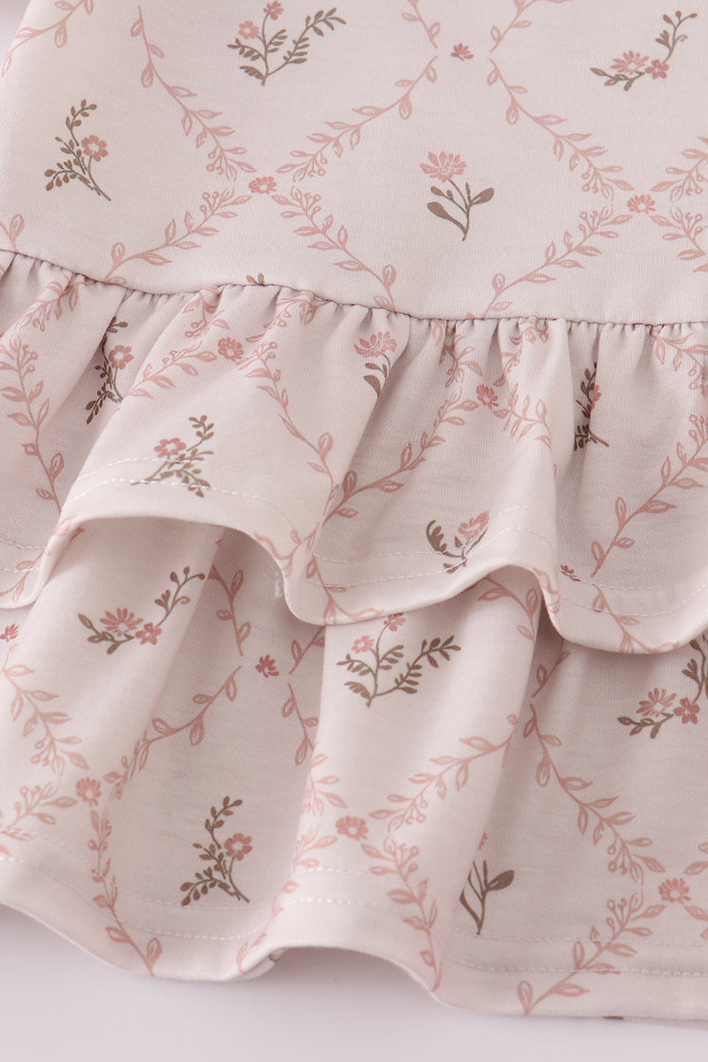 Floral patterned fabric with ruffled edge on a white background