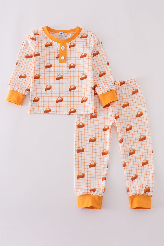 Children's pajama set with pizza pattern on a light gray background