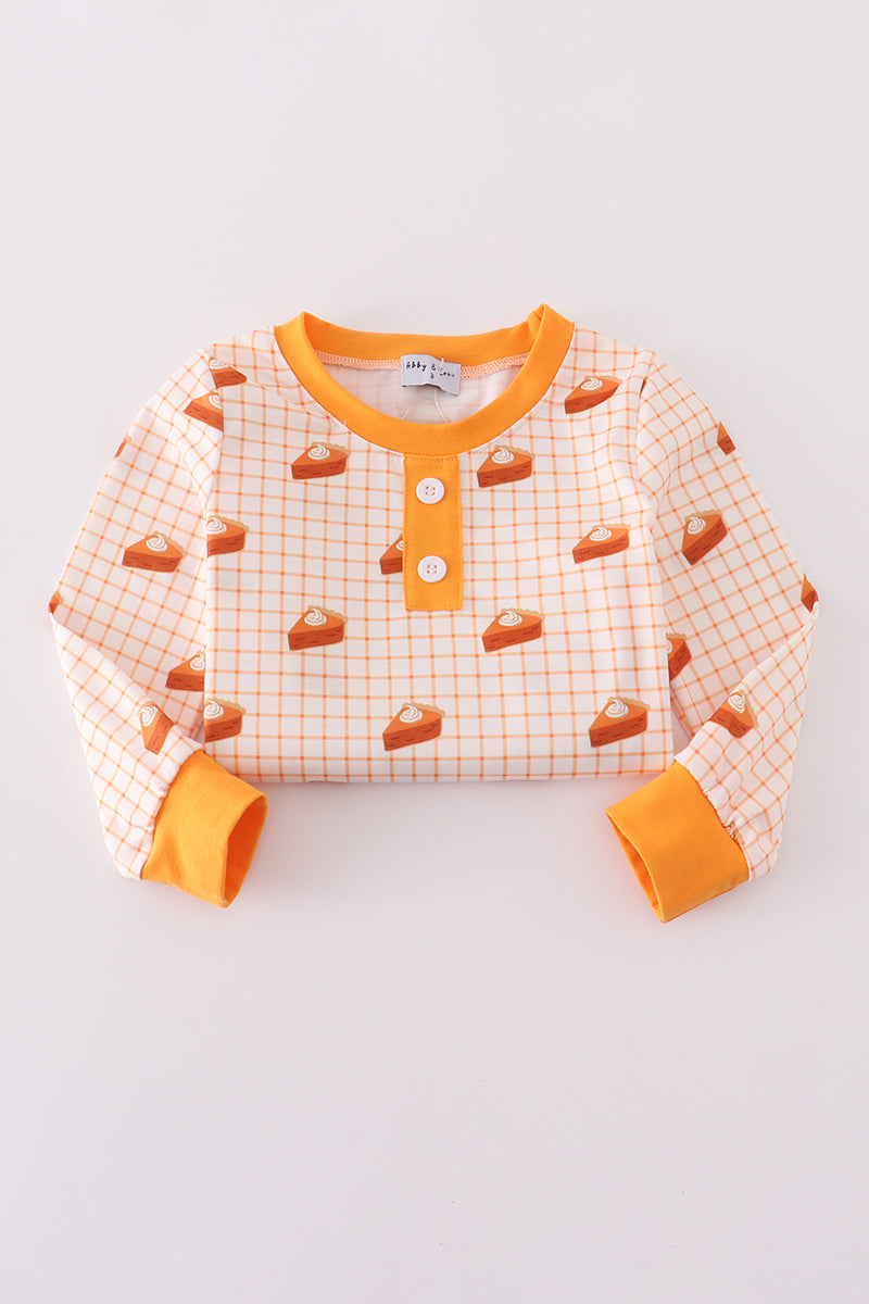 Children's long-sleeve shirt with orange buttons and pattern on a light gray background