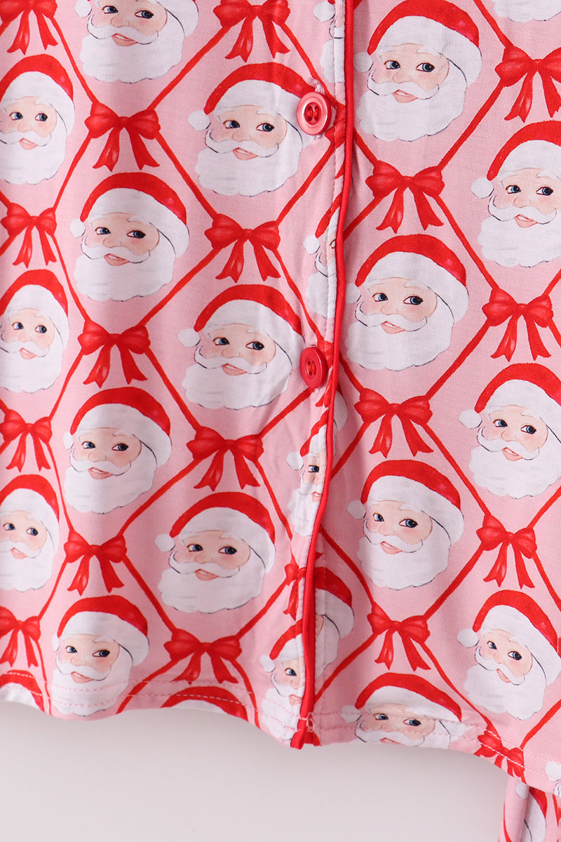 Gift wrap with Santa Claus pattern on a pink background
