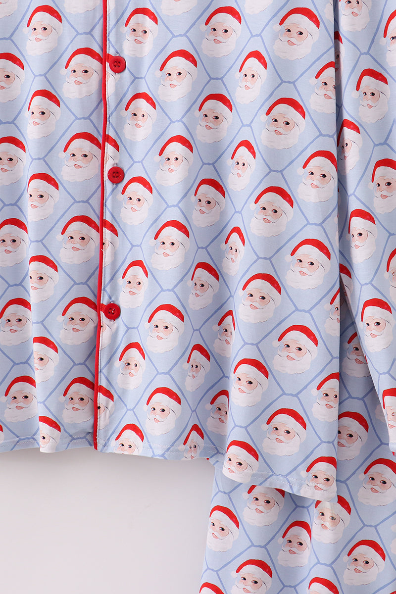 Curtains with a pattern of Santa Claus faces on a blue background