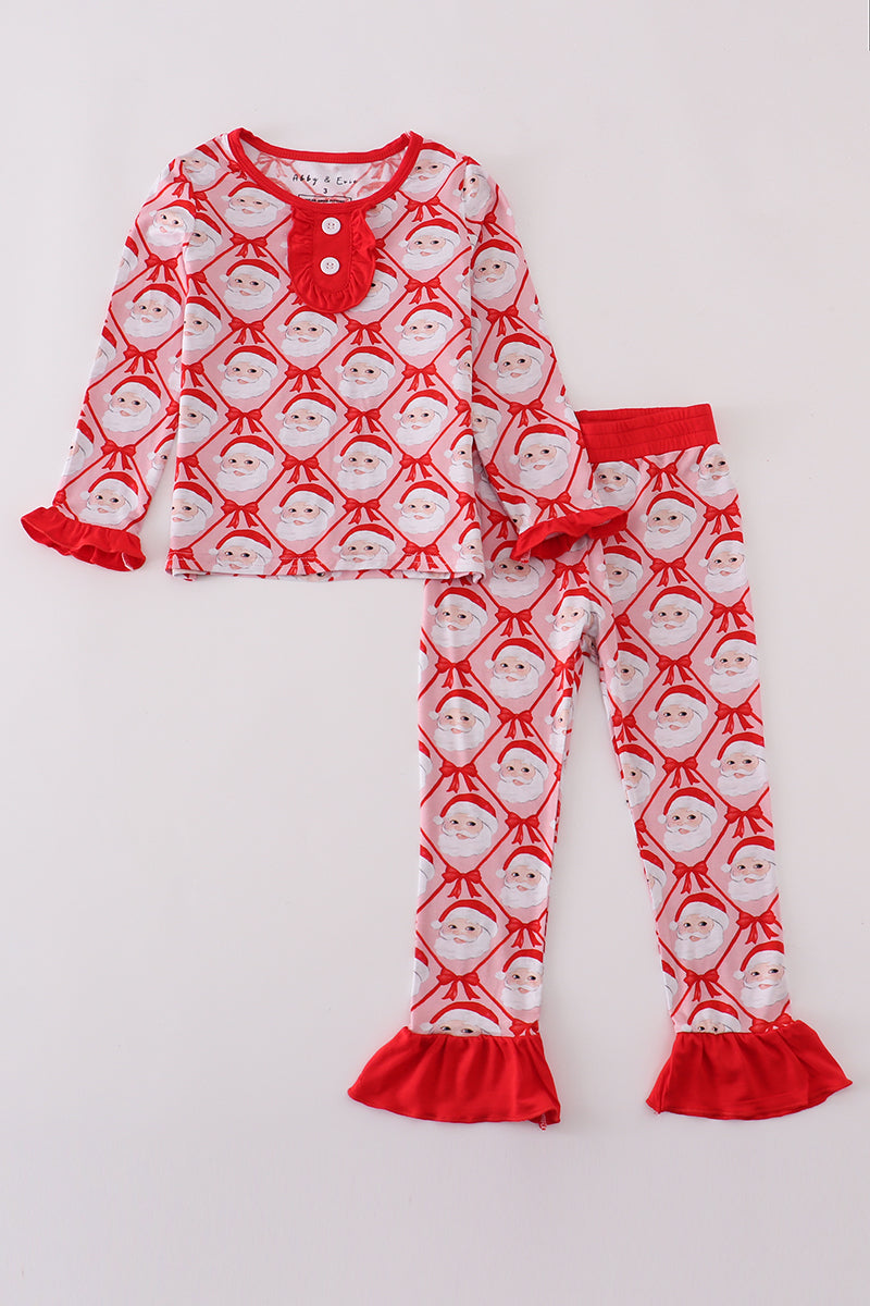 Children's pajama set with Santa Claus pattern on a white background