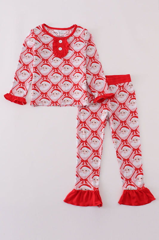 Children's pajama set with Santa Claus pattern on a white background