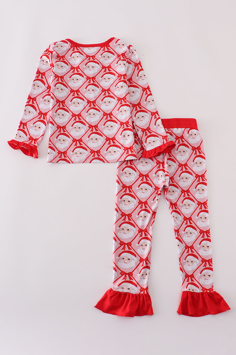 Children's pajama set with Santa Claus pattern on a white background