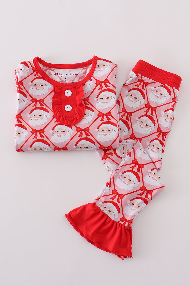 Children's pajama set with Santa Claus pattern on a white background