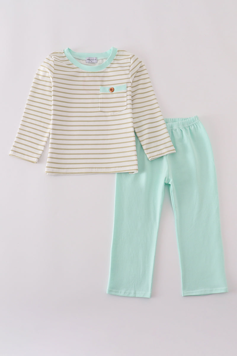 Children's outfit with striped shirt and mint green pants on a light gray background