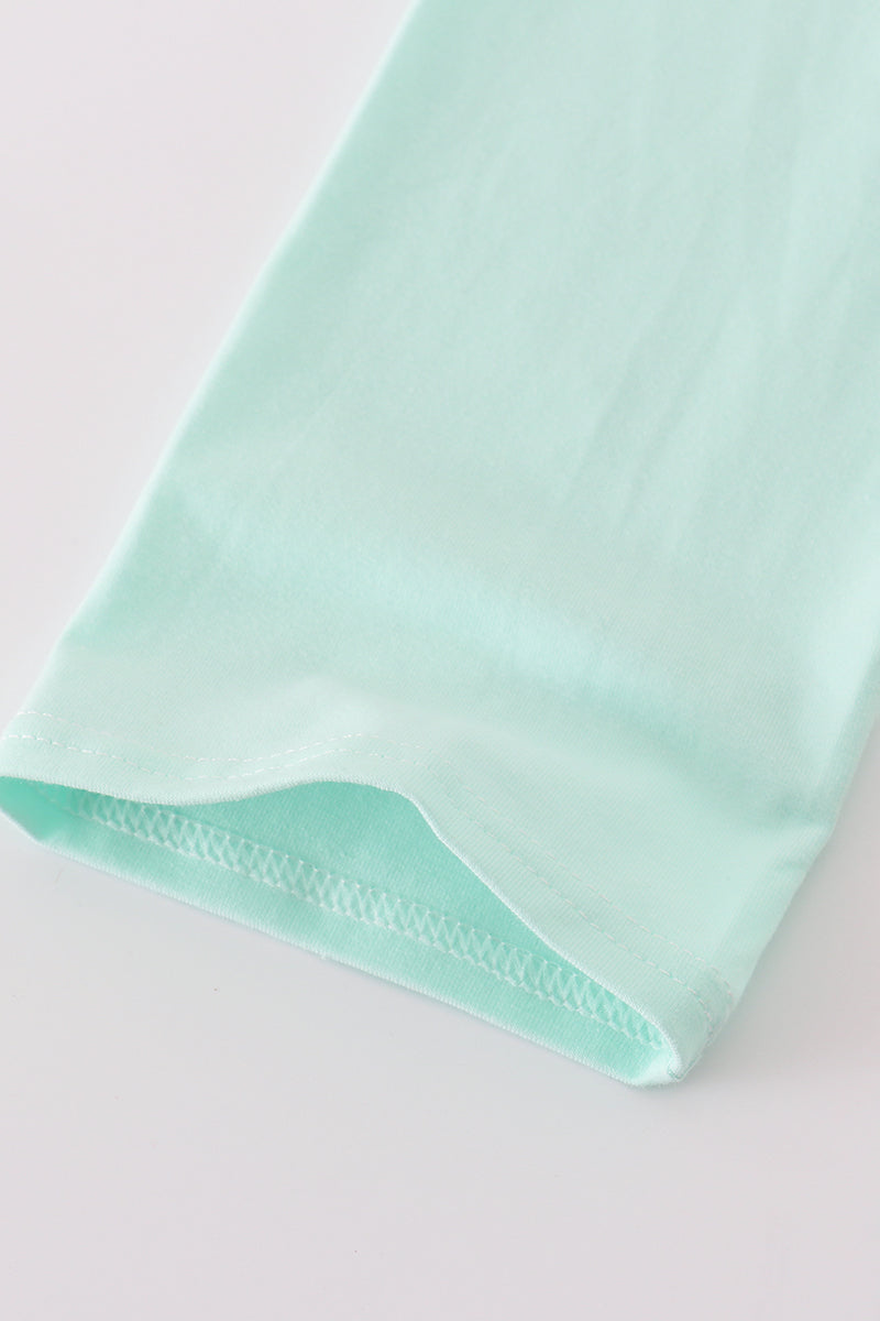 Light green fabric on a light gray background