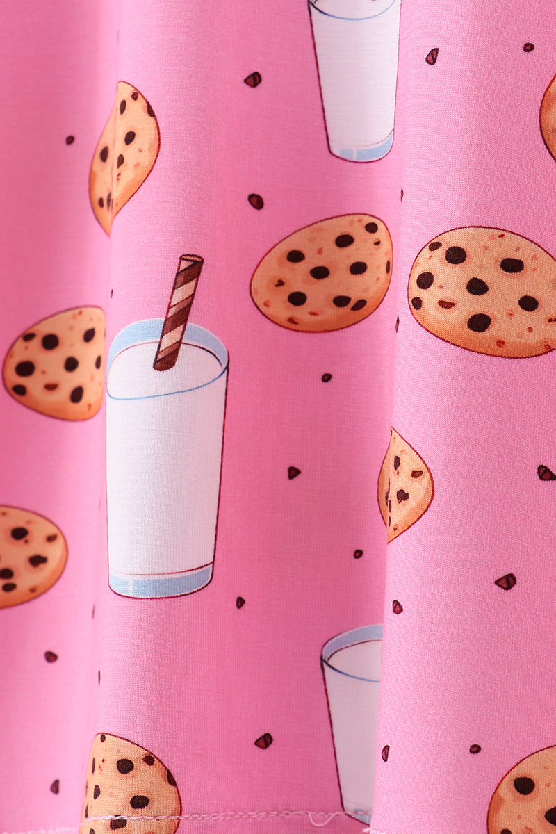 Pink fabric with cookies and milk pattern