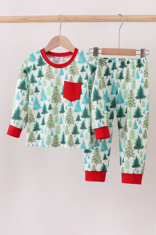 Children's pajama set with forest pattern and red accents on a hanger against a white background
