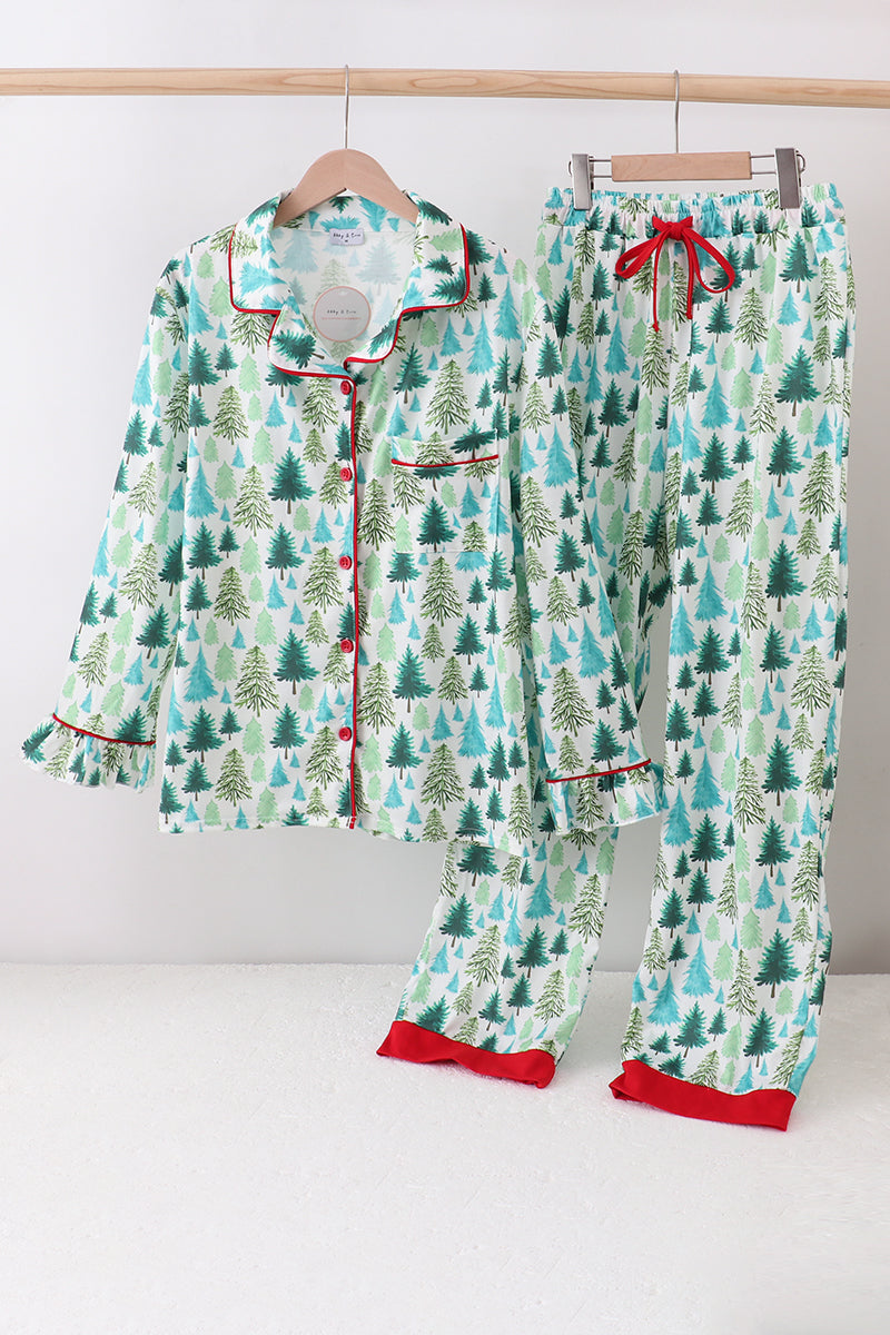 Christmas-themed pajama set with trees and red trim on a white background