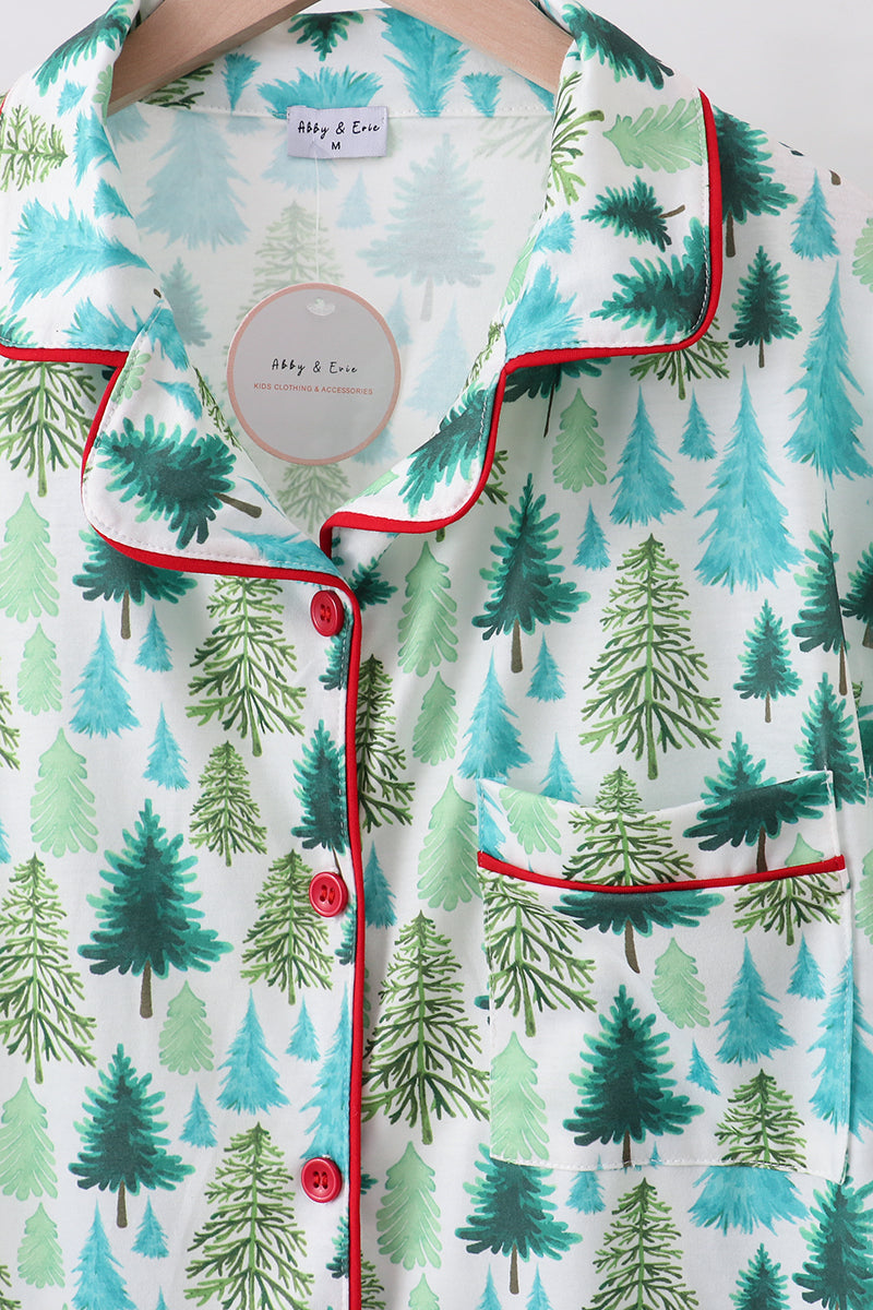 Patterned shirt with green trees and red accents on a white background