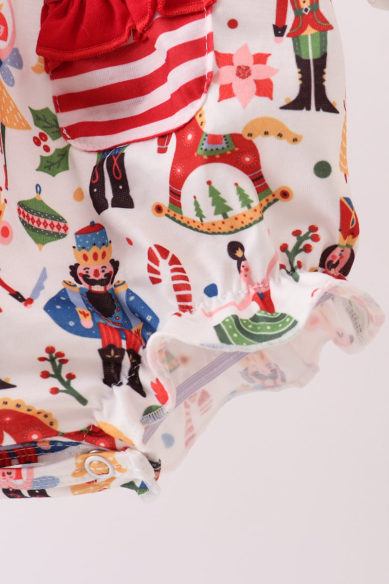 Close-up of a fabric with Nutcracker-themed print on a white background