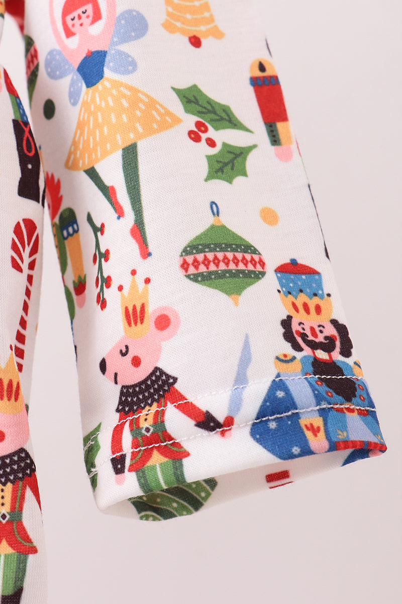 Colorful fabric with Christmas-themed designs on a white background