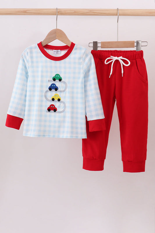 Children's pajama set with cars on a white background