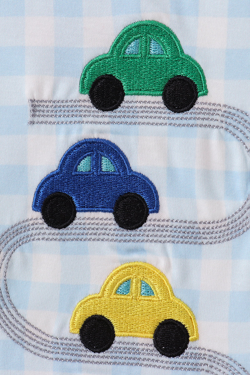 Three embroidered cars (green, blue, yellow) on a checkered fabric background