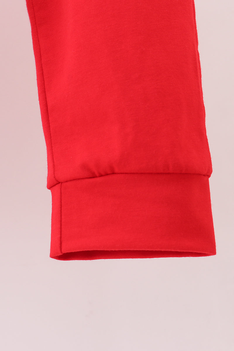 Close-up of a red fabric with a light pink background