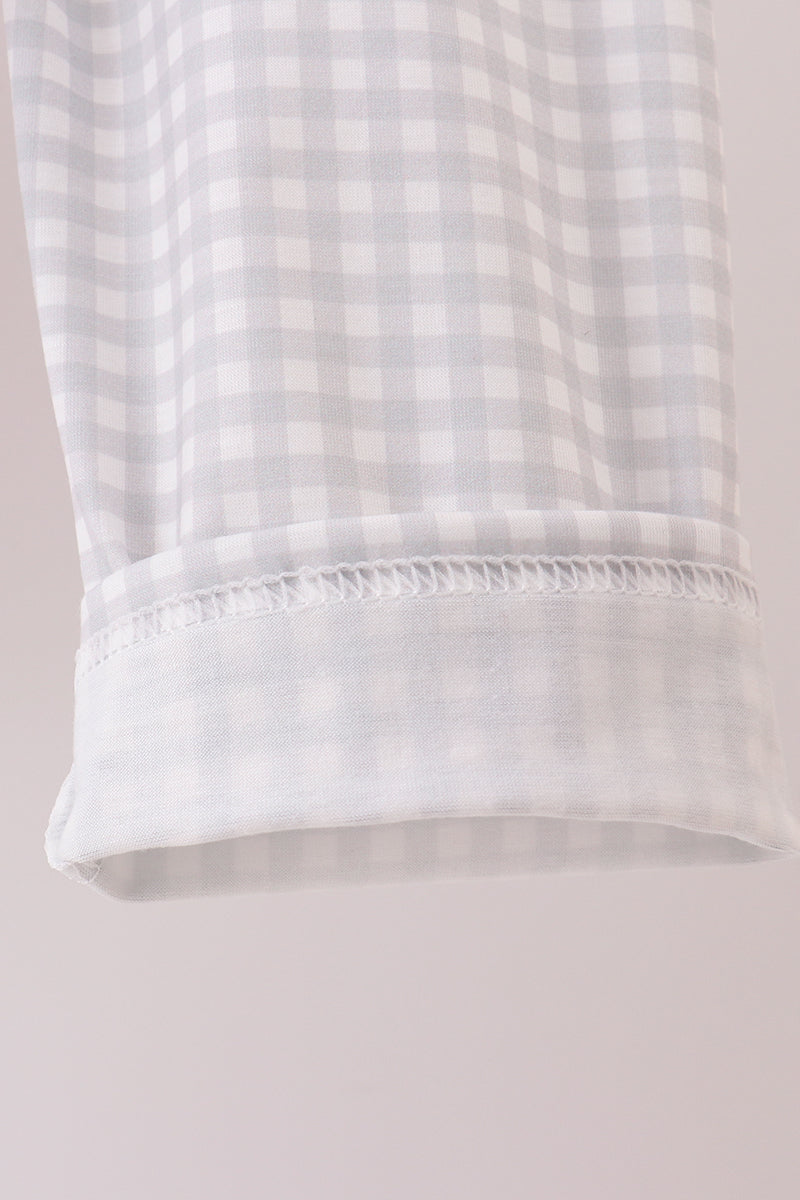 Close-up of a white checkered fabric with a beige background