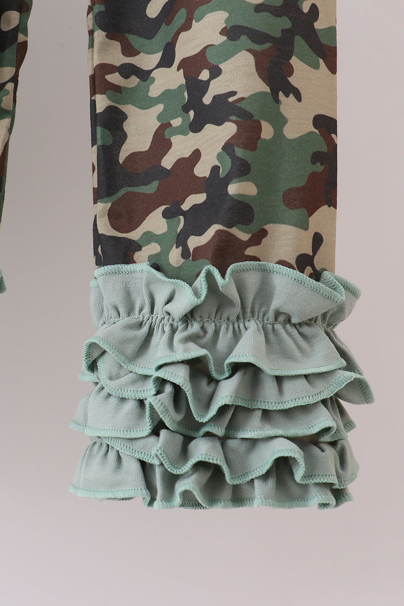Camouflage pants with ruffled green bottom section on a light gray background