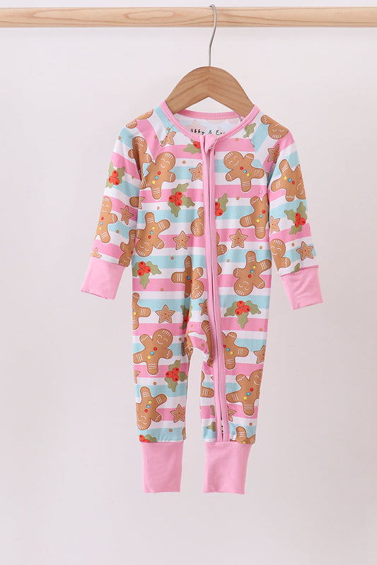 Children's onesie with gingerbread man pattern on a hanger against a white background