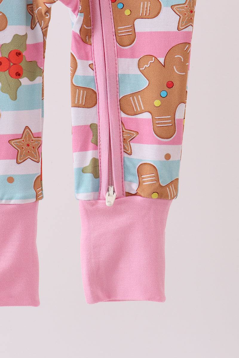 Children's pink zip-up hoodie with gingerbread man pattern on a light gray background