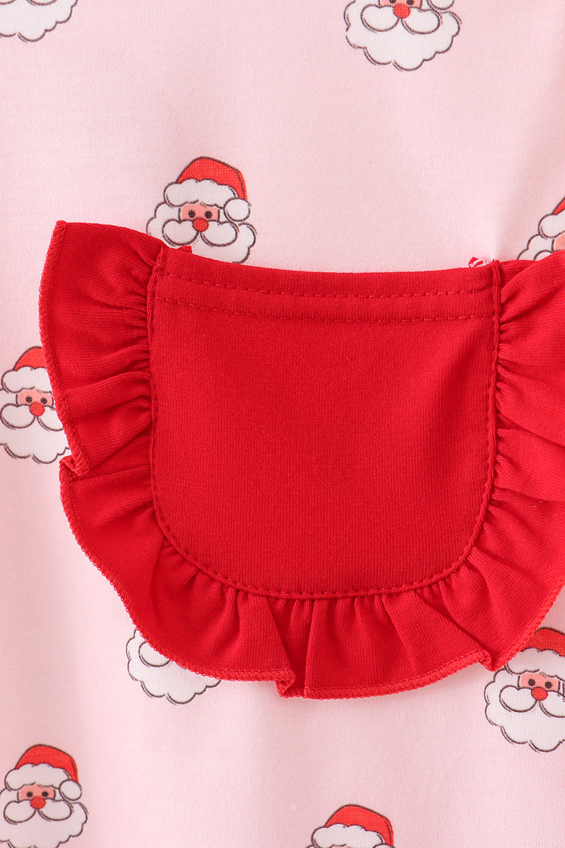 Red ruffled collar on a pink background with Santa Claus illustrations