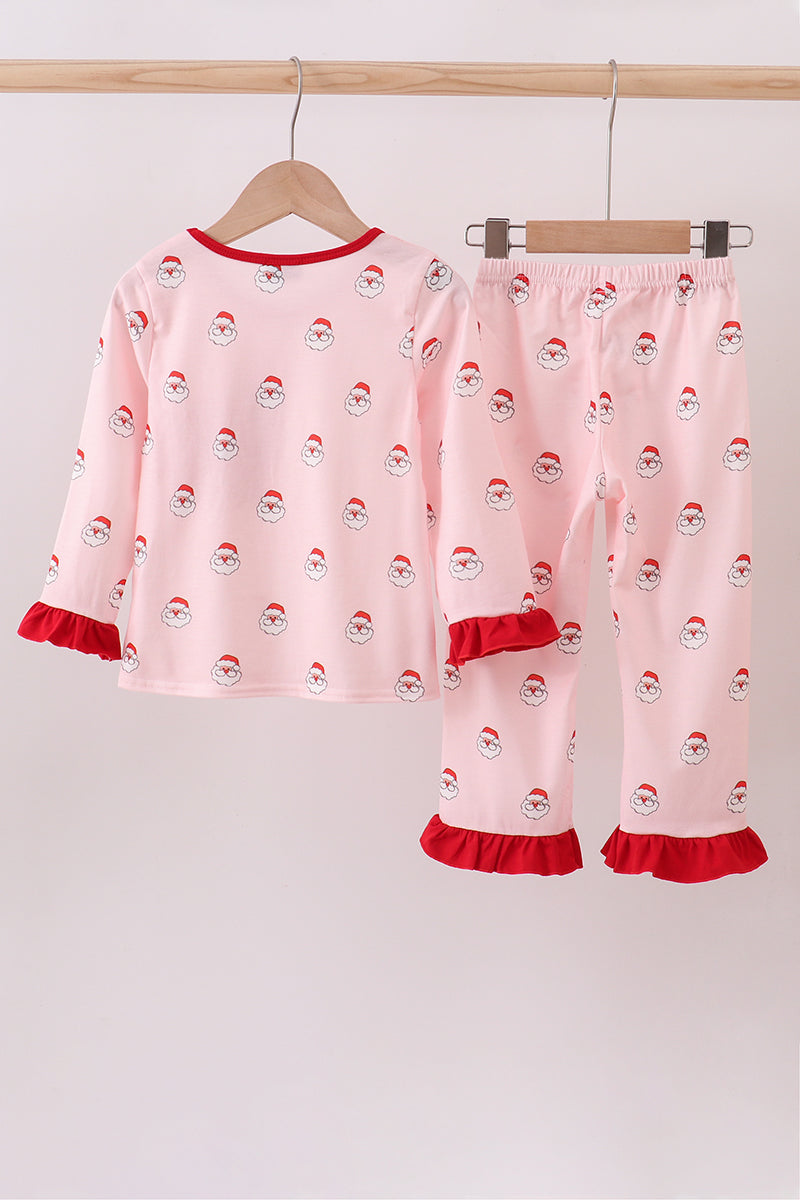 Pink pajama set with Santa Claus pattern on a white background
