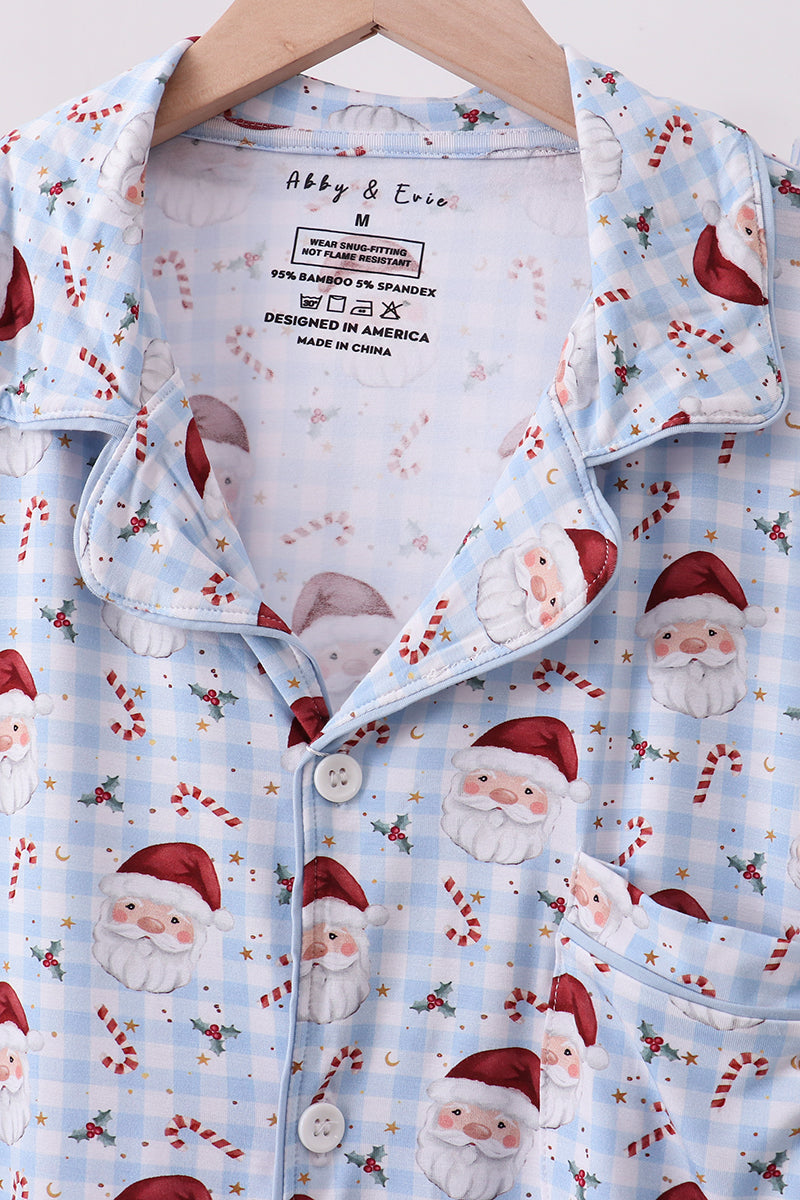 Christmas-themed shirt with Santa Claus pattern on a hanger