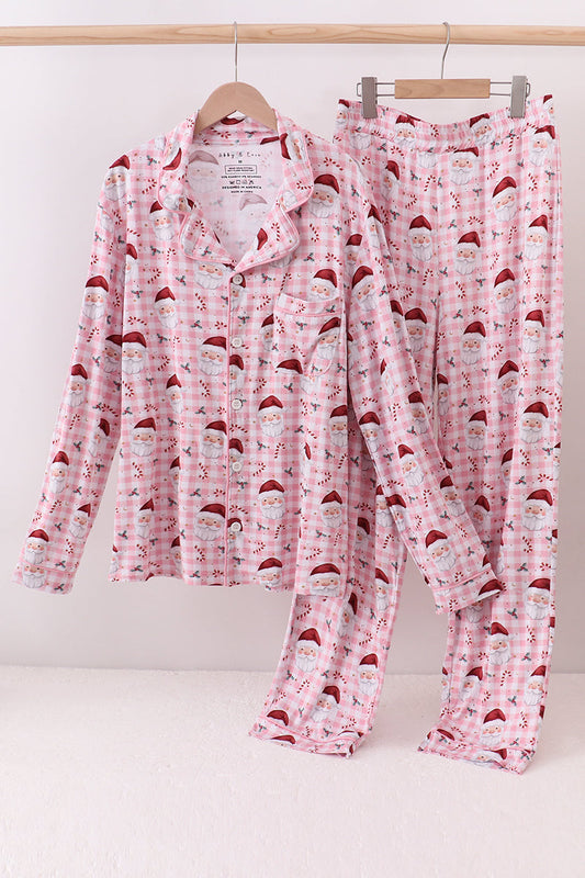Pink pajama set with Santa hats on a white background