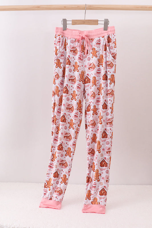 Flannel pajama pants with gingerbread man pattern on a white background