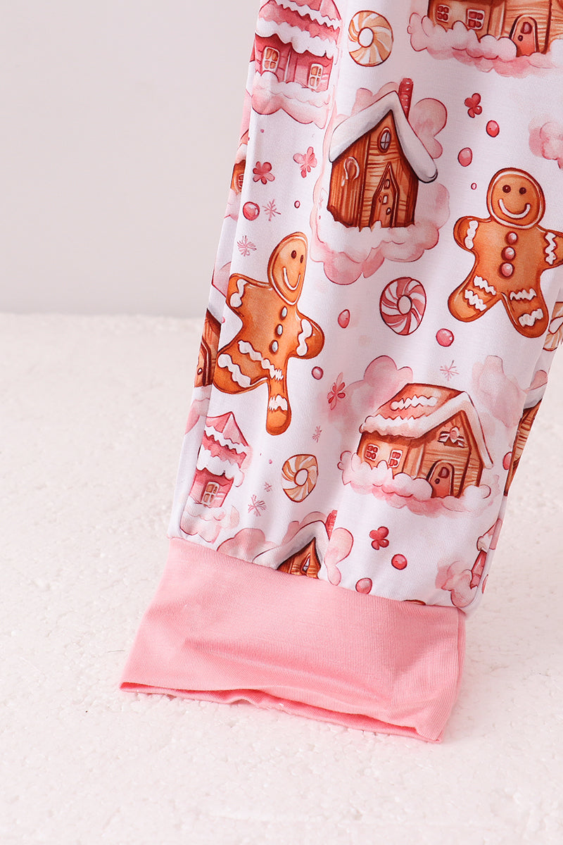 Leggings with gingerbread man and house pattern on a white background