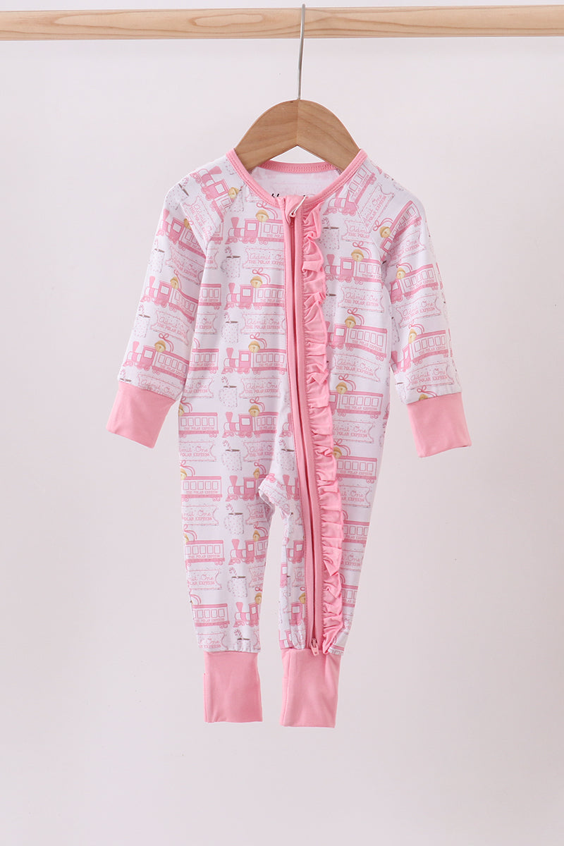 Pink and white baby onesie with flamingo pattern on a wooden hanger against a white background