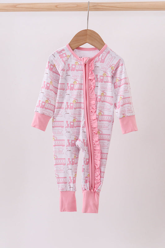 Pink and white baby onesie with flamingo pattern on a wooden hanger against a white background