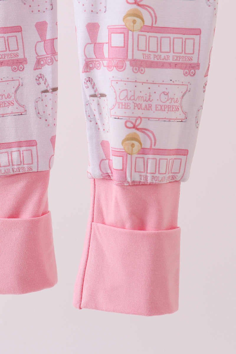 Pink pajama pants with 'The Polar Express' train design on a light pink background