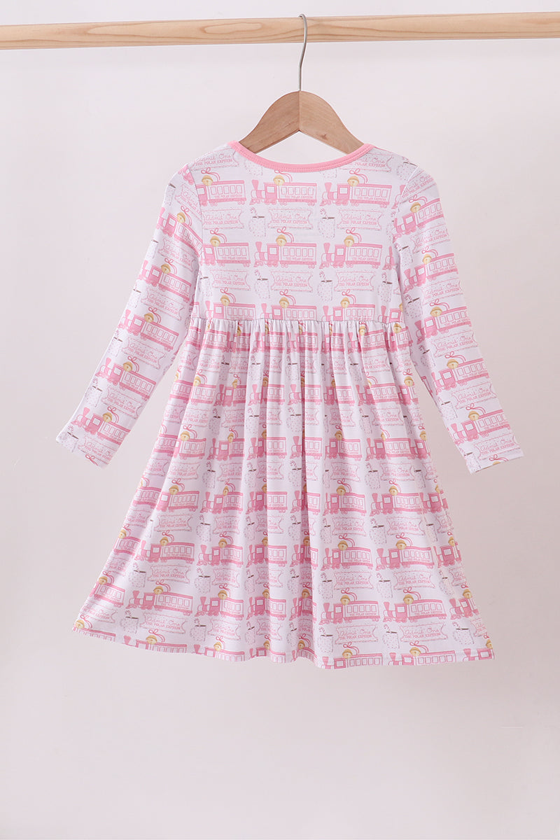 Children's dress with a pattern on a hanger against a white background