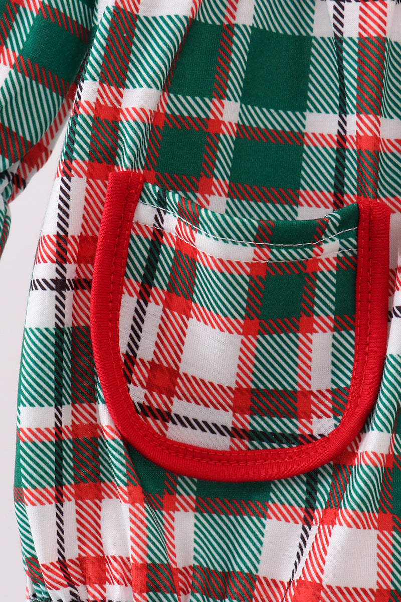 Close-up of a plaid pattern with green, red, and white colors.