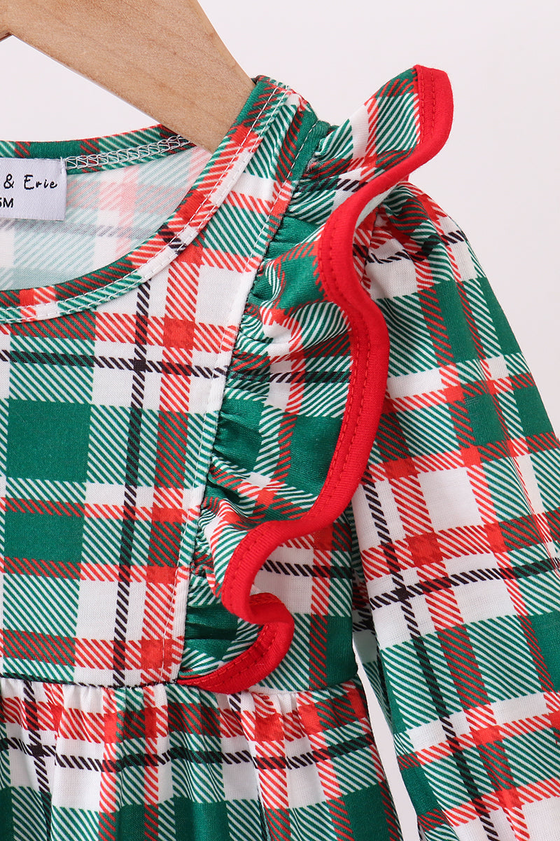 Plaid dress with red trim on a white background