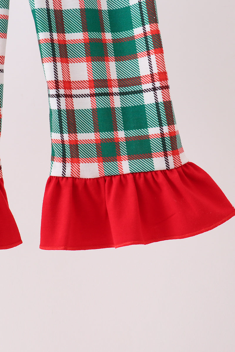Plaid dress with a red hem on a light gray background