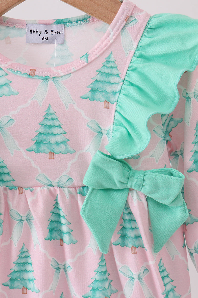 Pink dress with green tree and bow pattern, brand label visible