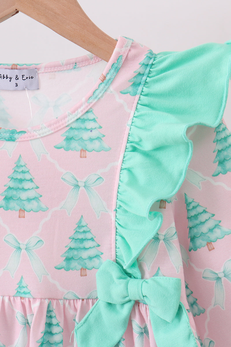 Baby dress with green tree and bow pattern on pink background