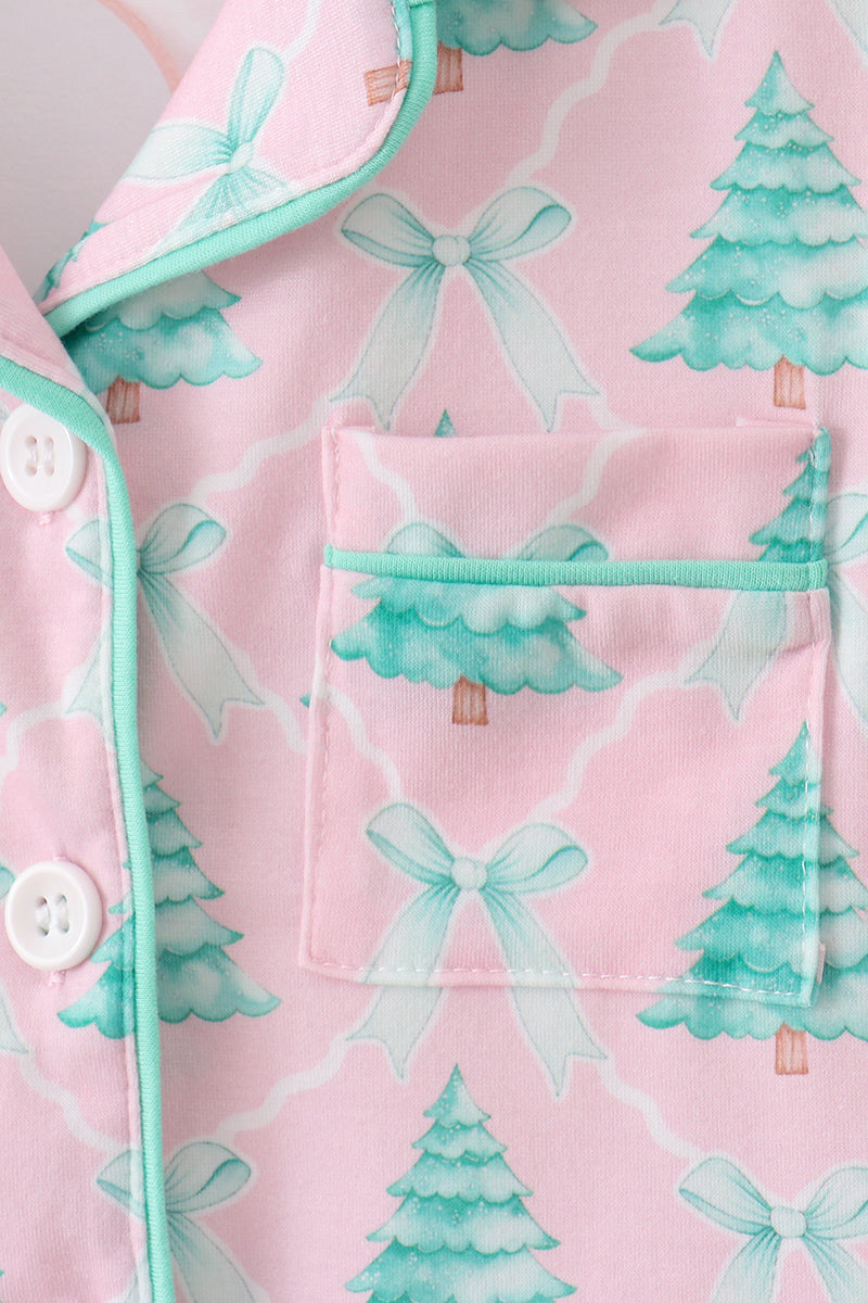 Pink pajama top with green trees and bows pattern
