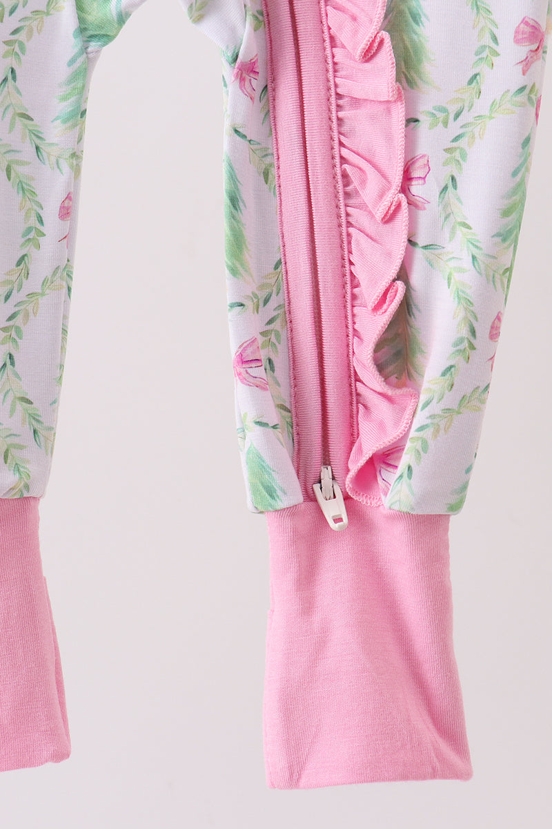Pink children's outfit with floral pattern on a white background