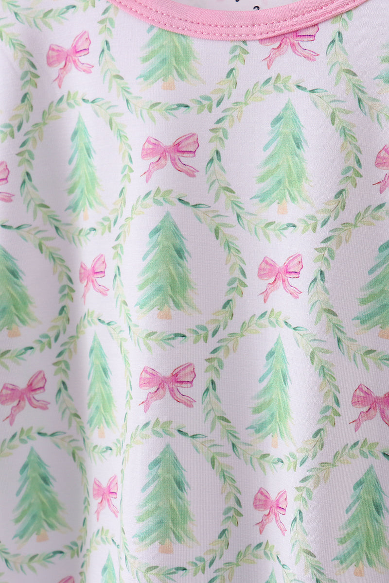 Fabric with Christmas tree and bow pattern on a white background