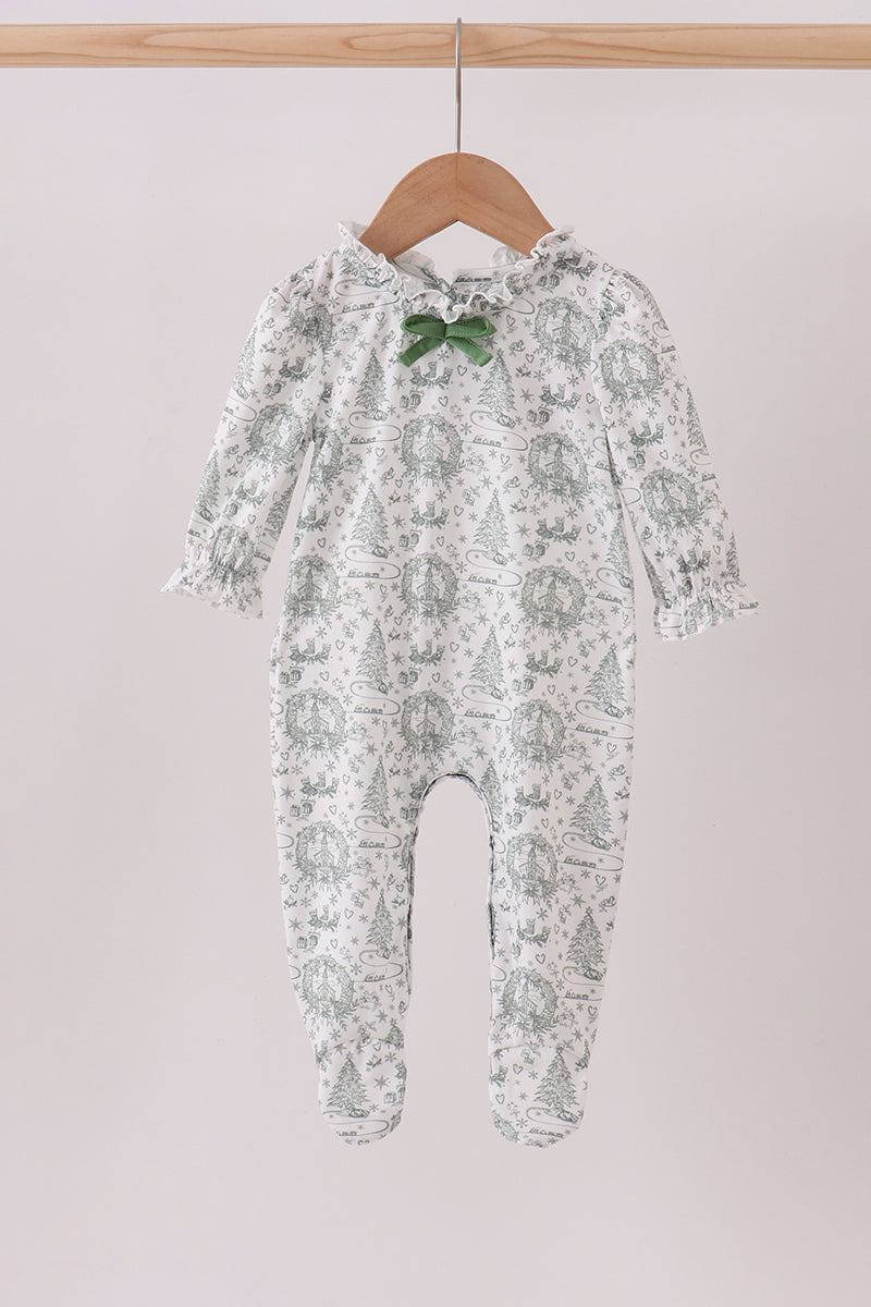 Baby onesie with floral pattern on a hanger against a plain background